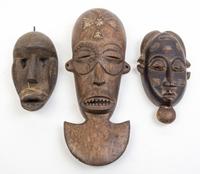 A Group of Six Masks Height of largest 21 inches.