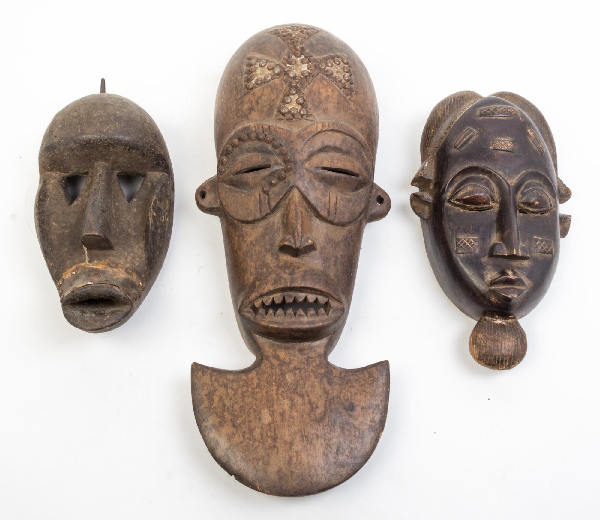 A Group of Six Masks Height of largest 21 inches.