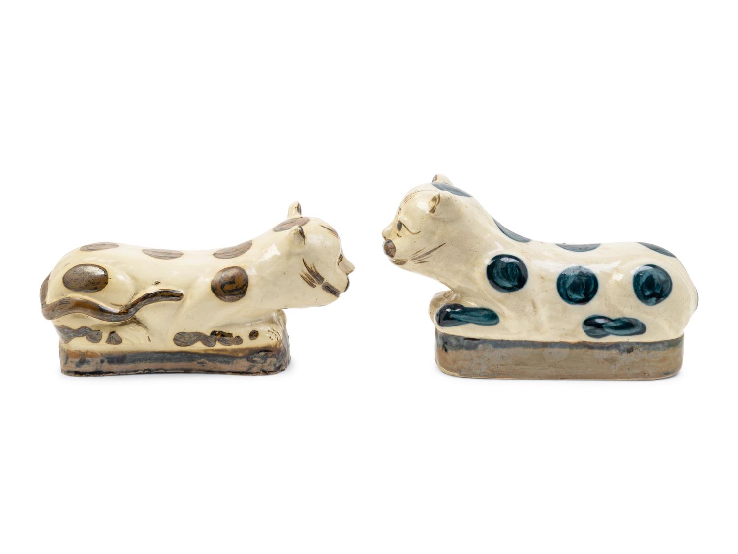 Two Chinese Beige Ground Porcelain 'Cat' Pillows