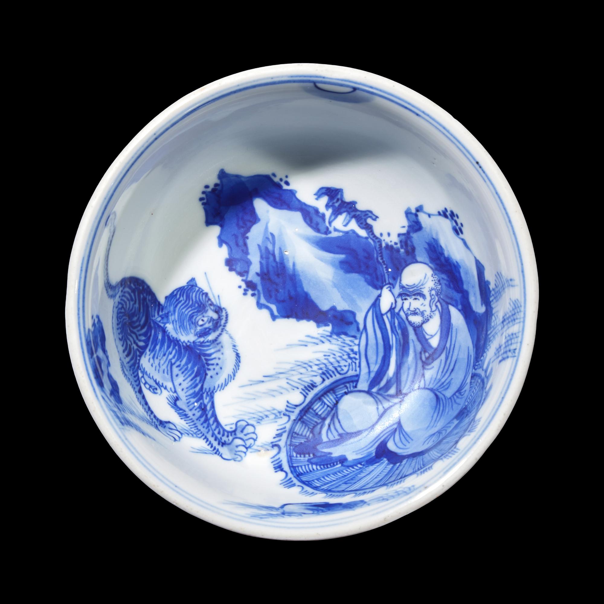 A Blue and White Porcelain Tiger and Lohan Bowl, Possibly 18th Century 或爲清中期 青花伏虎羅漢圖賞盤