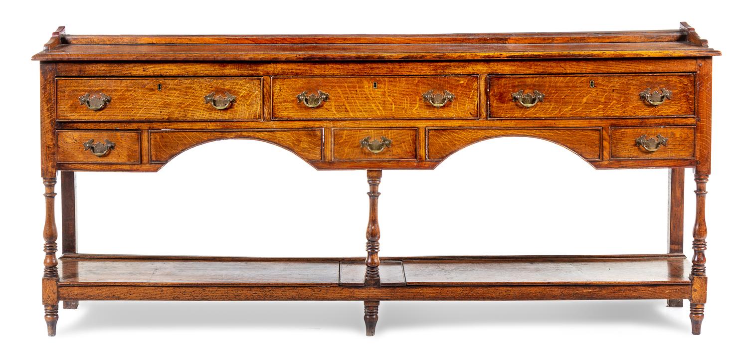 A George III Provincial Oak Sideboard Height 35 1/2 x width 83 1/2 x depth 16 1/2 inches. — 18TH CENTURY