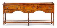 A George III Provincial Oak Sideboard Height 35 1/2 x width 83 1/2 x depth 16 1/2 inches. — 18TH CENTURY