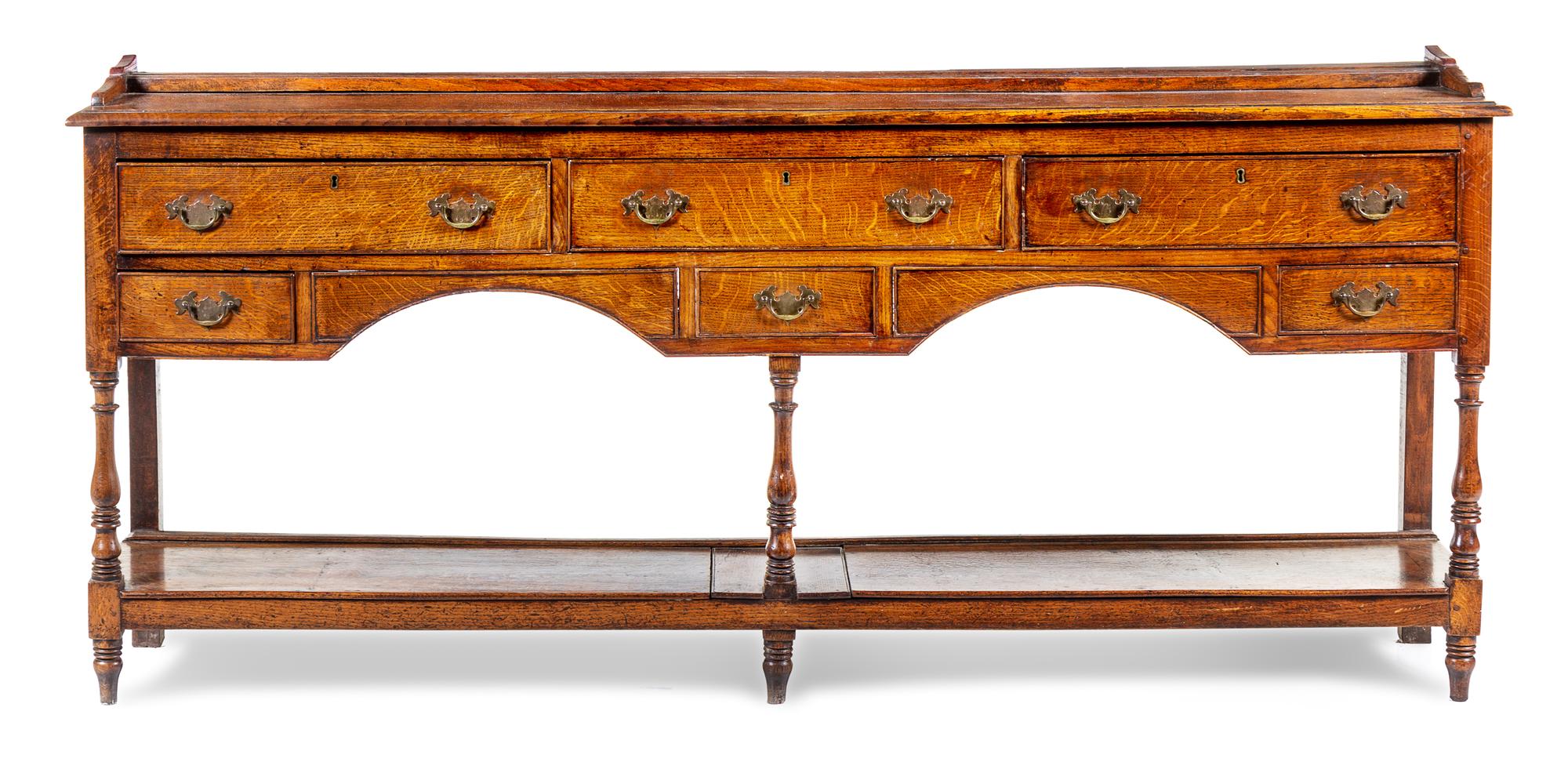 A George III Provincial Oak Sideboard Height 35 1/2 x width 83 1/2 x depth 16 1/2 inches. — 18TH CENTURY