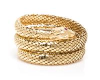 An 18 Karat Yellow Gold and Ruby Flexible Serpent Bracelet, Italian, 38.90 dwts.