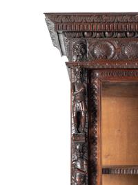 An Austrian Carved Walnut Cabinet