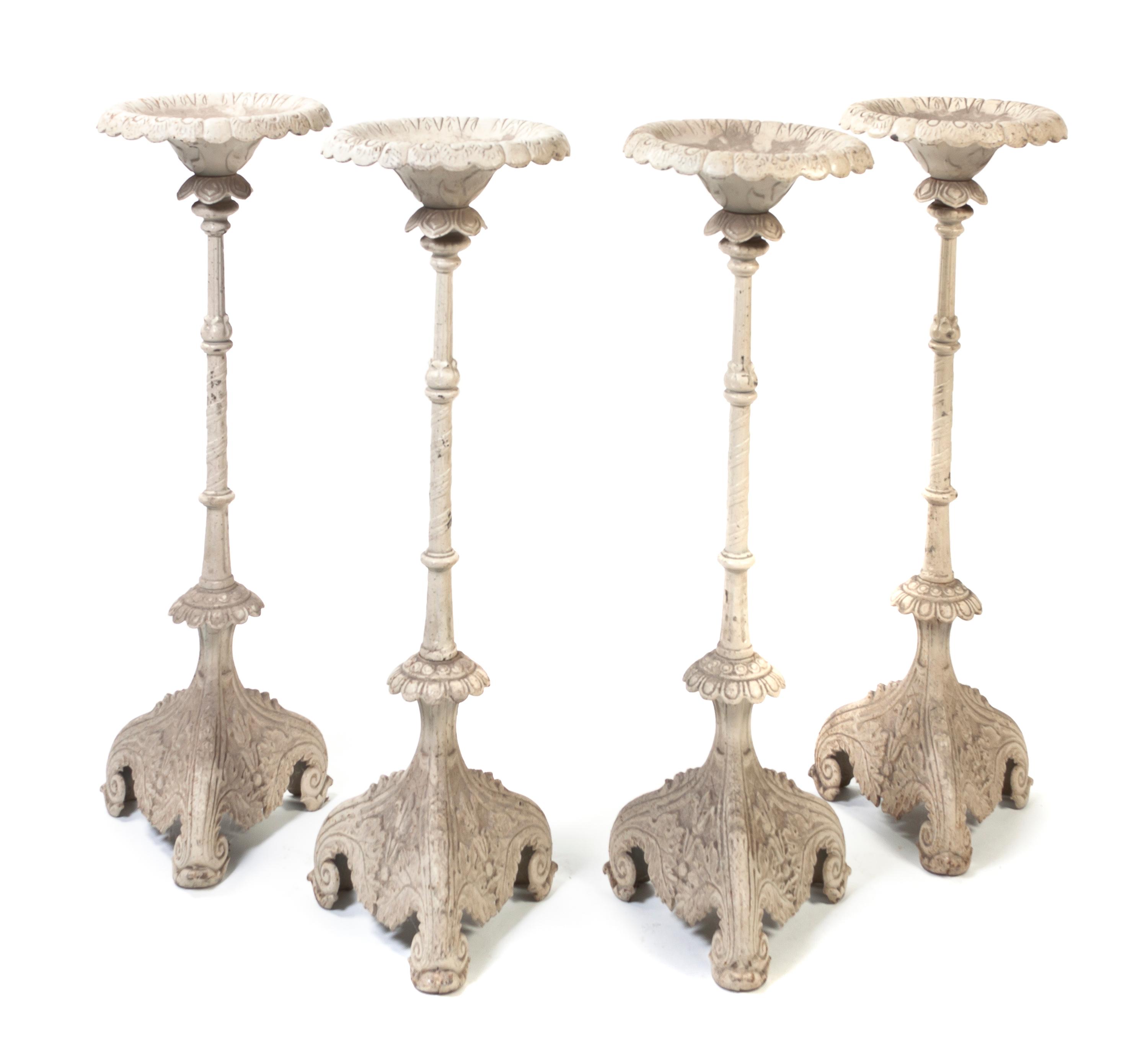 A Set of Four Victorian Cast Iron Pricket Sticks, Height 42 1/2 inches.