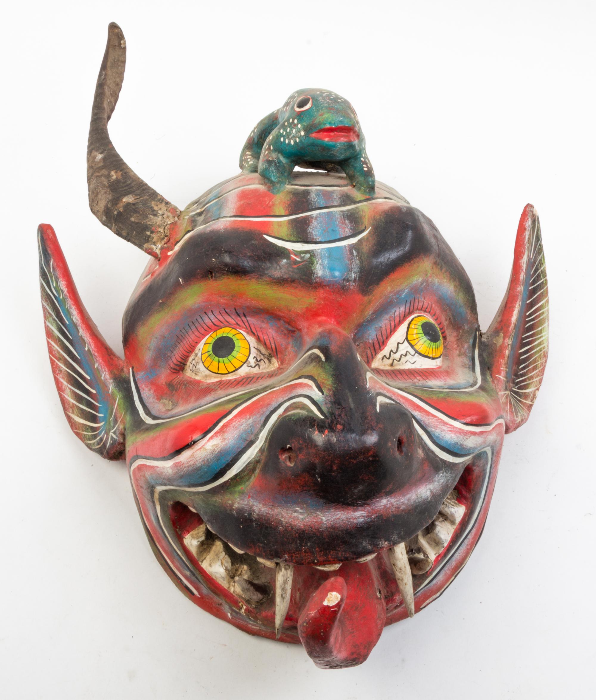Five Mexican Painted Masks Height of largest 25 inches.