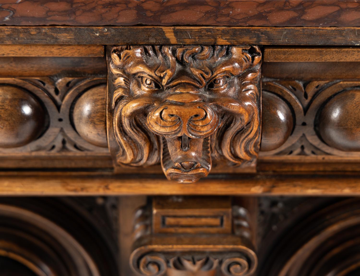A Renaissance Revival Carved Walnut Marble-Top Cabinet