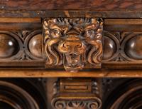 A Renaissance Revival Carved Walnut Marble-Top Cabinet