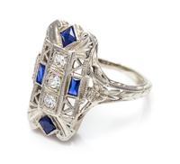 An 18 Karat White Gold, Diamond and Synthetic Sapphire Ring, 2.20 dwts.