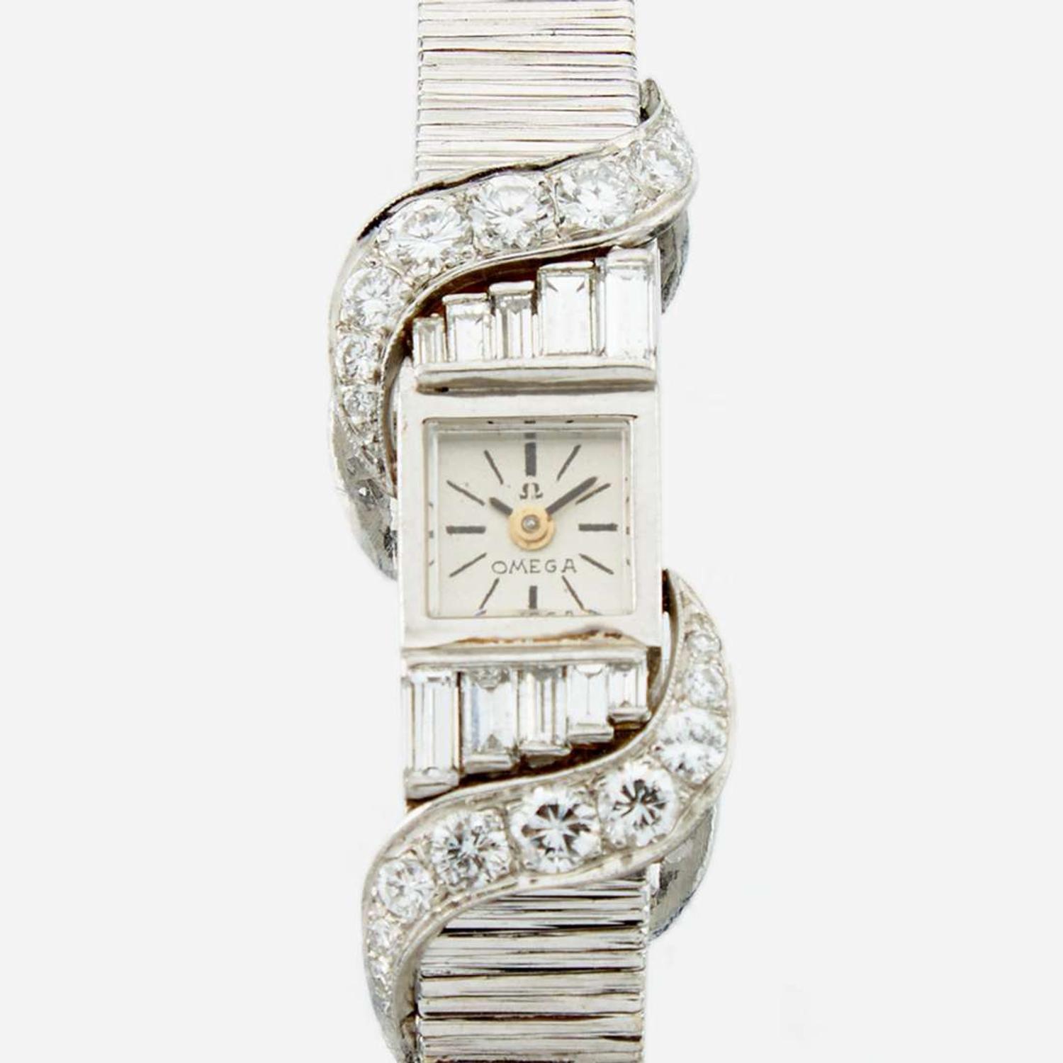 A white gold and diamond bracelet watch, Omega