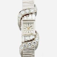 A white gold and diamond bracelet watch, Omega