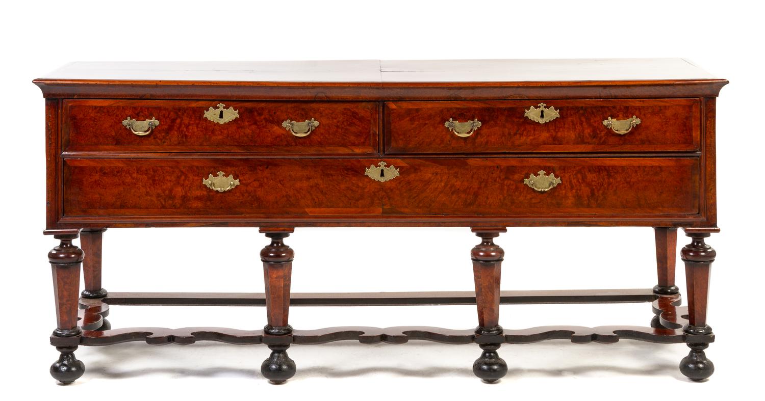 An English Burlwood Sideboard, Height 32 1/4 x width 71 3/4 x depth 22 1/2 inches.
