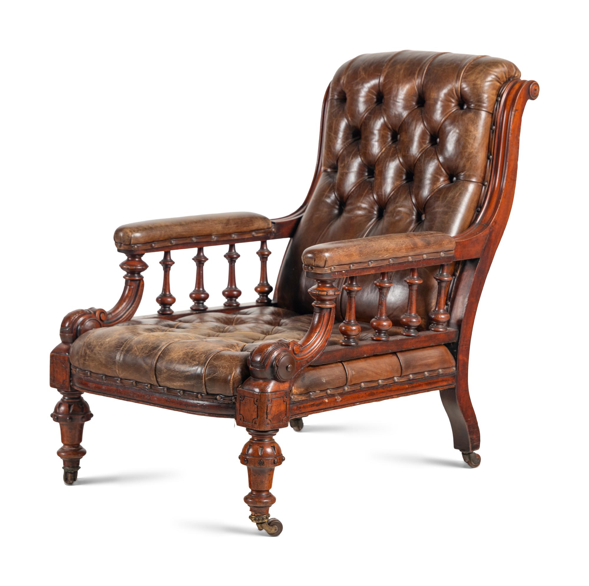 A Pair of English Carved Mahogany Buttoned Leather Armchairs
