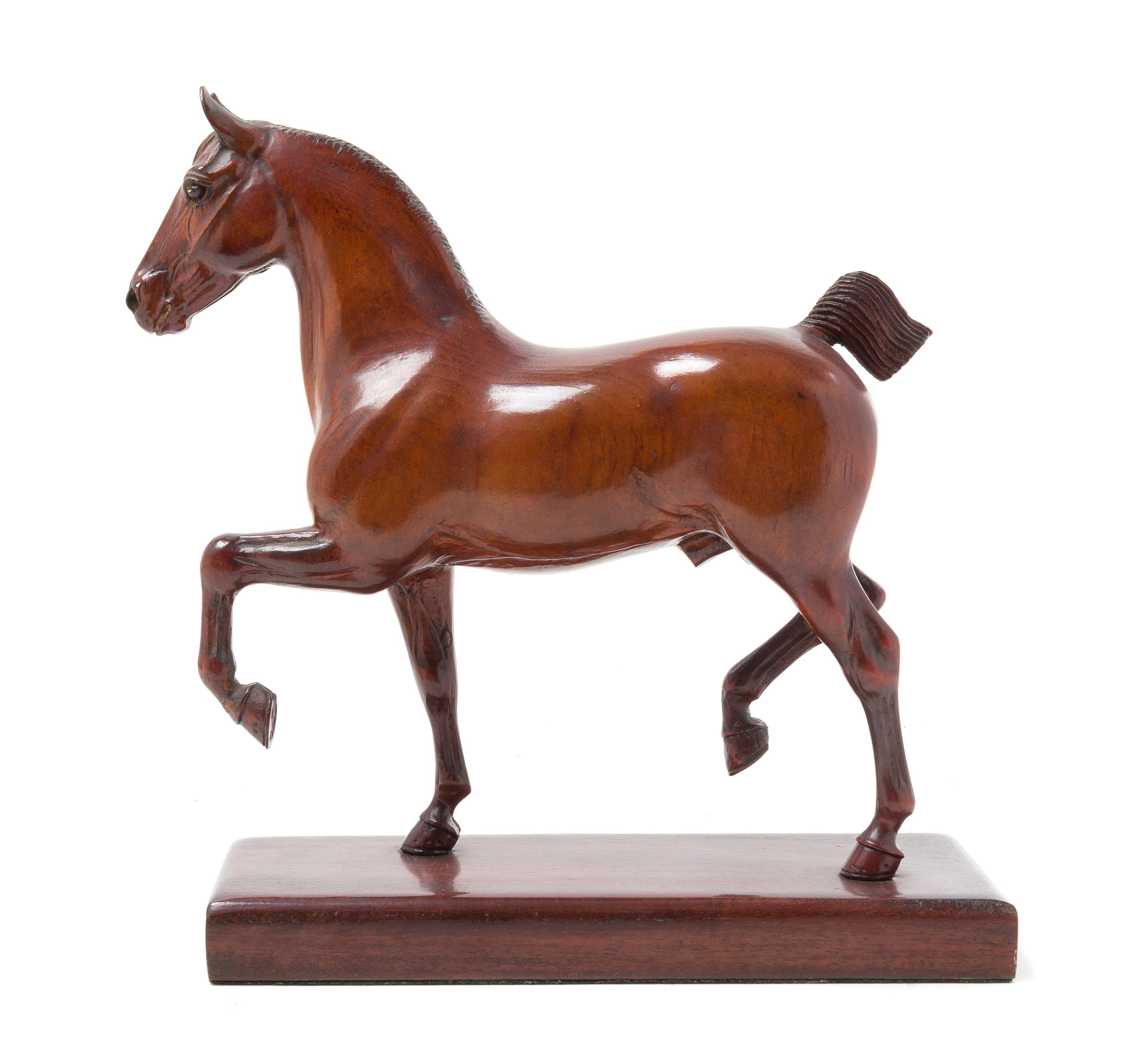 A Carved Wood Figure of a Horse Height 12 inches. — PETER GIBA, 20TH CENTURY