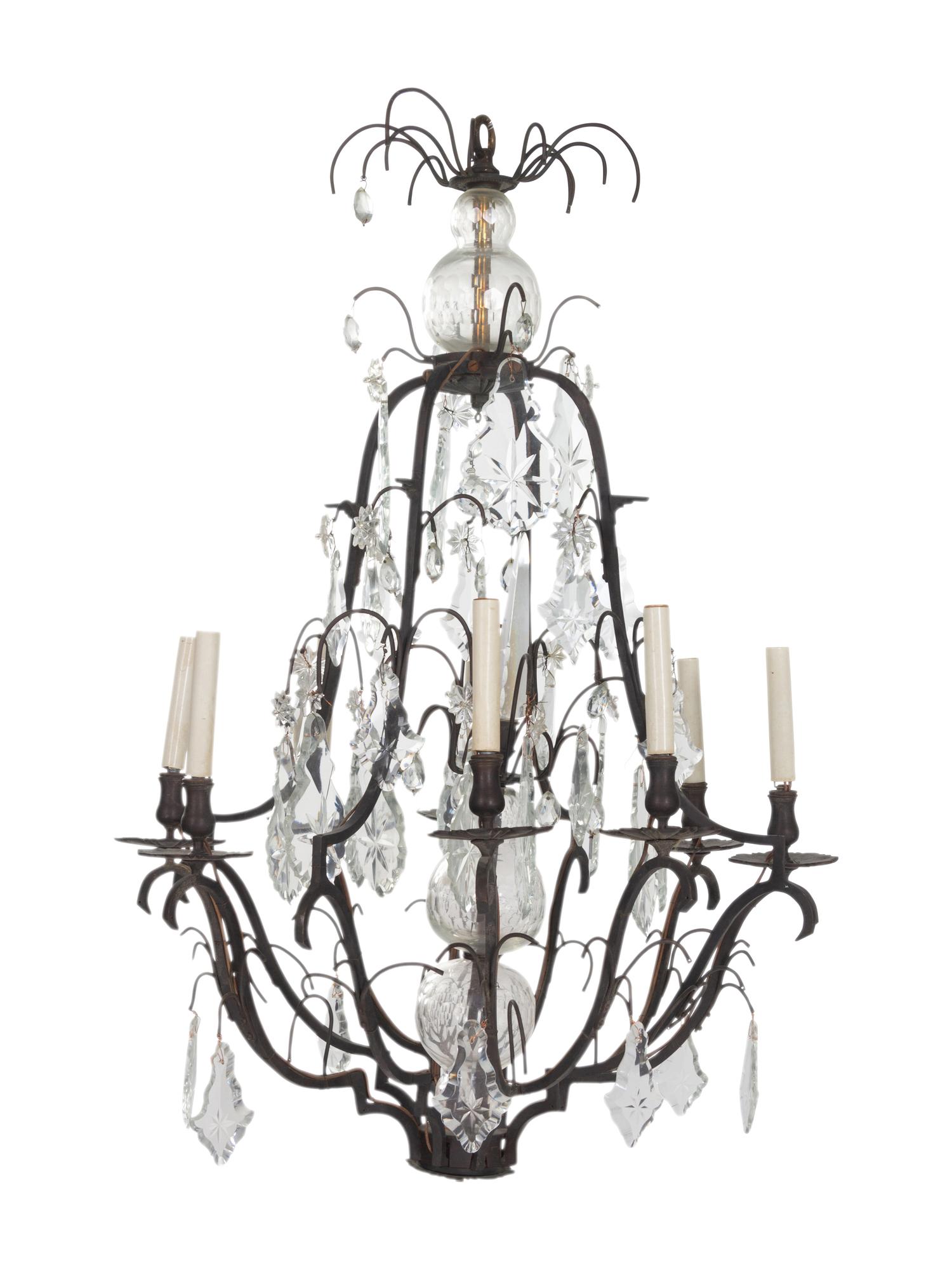 A Continental Cast Metal and Cut Glass Eight-Light Chandelier