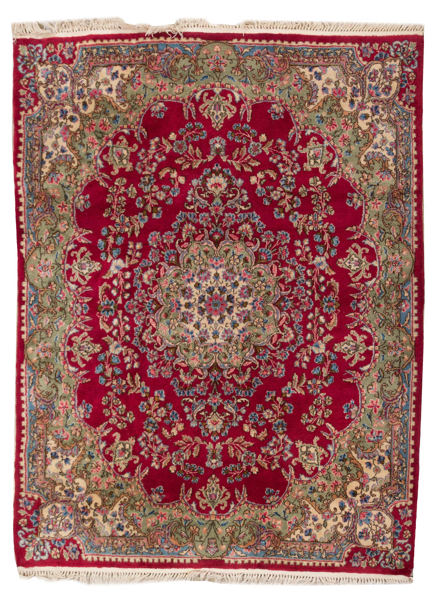 A Kirman Wool Rug, 6 feet 1 inch x 4 feet 9 inches.