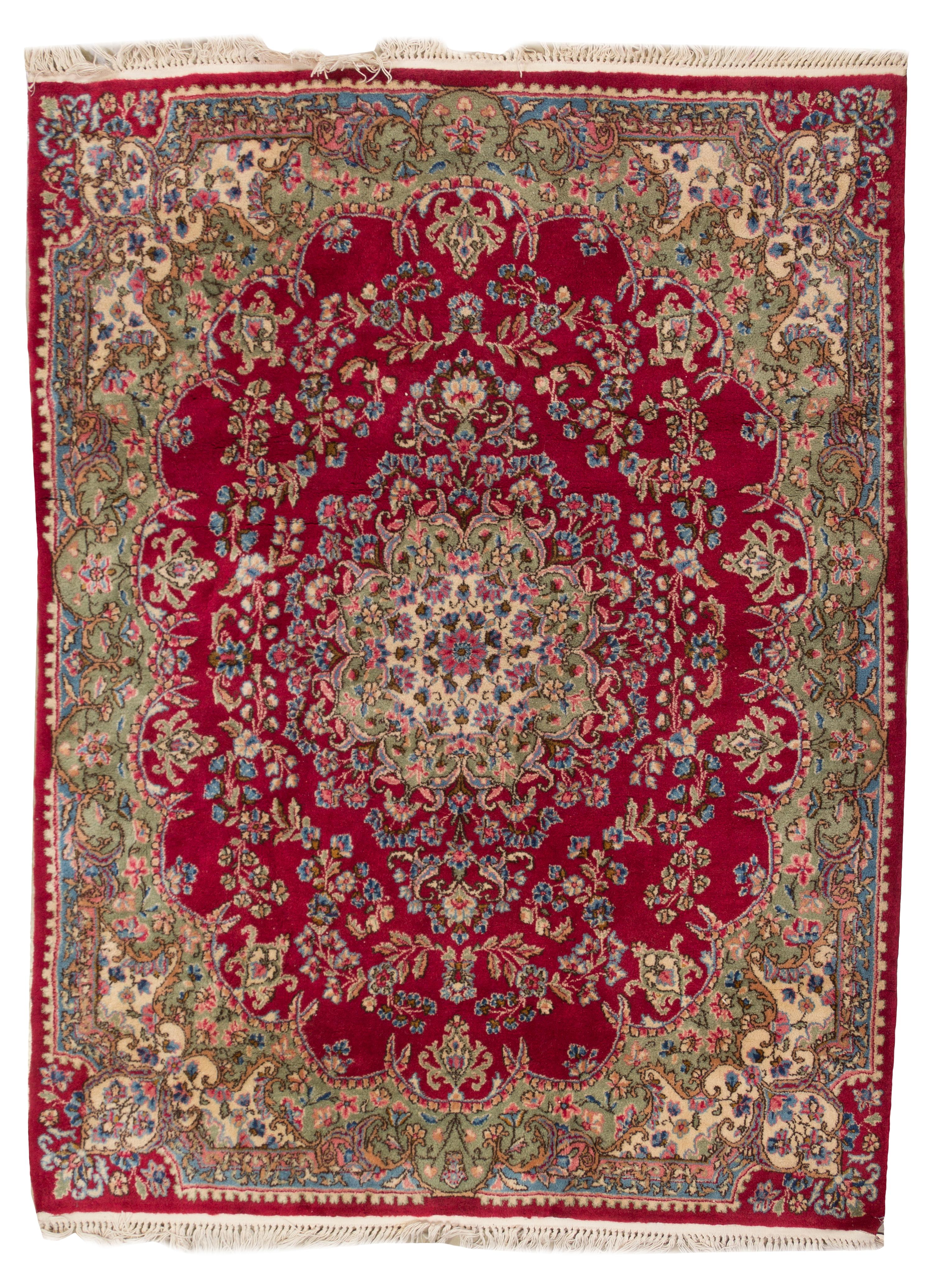 A Kirman Wool Rug, 6 feet 1 inch x 4 feet 9 inches.