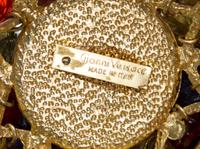 A Gianni Versace Multicolor Floral and Greco Link Triple Strand Belt, Length of shortest strand: 27"- 30"; Medallion: 2.5" x 2.5".