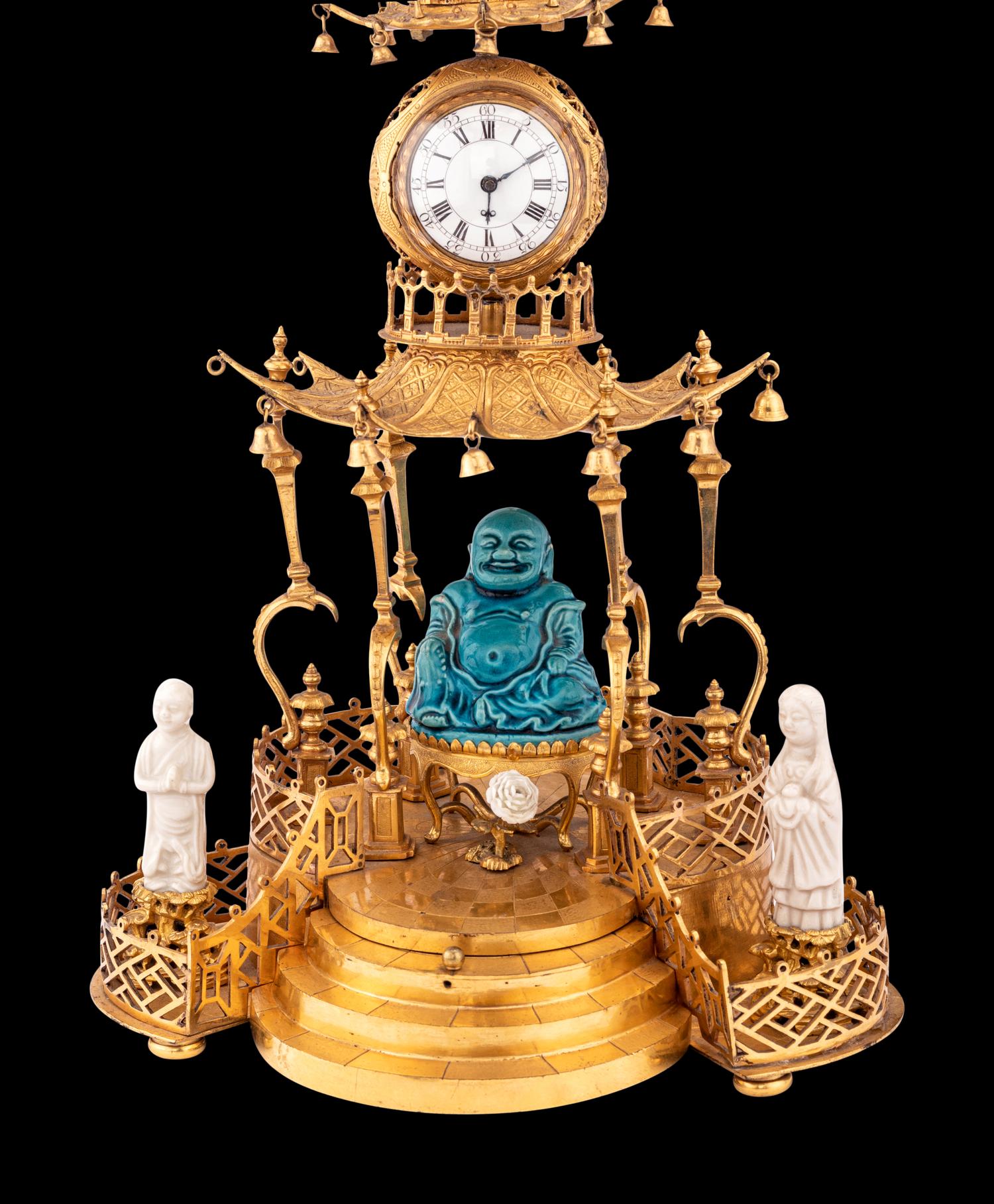 A Louis XV Style Gilt Bronze and Chinese Porcelain Mounted Pagoda-Form Mantel Clock