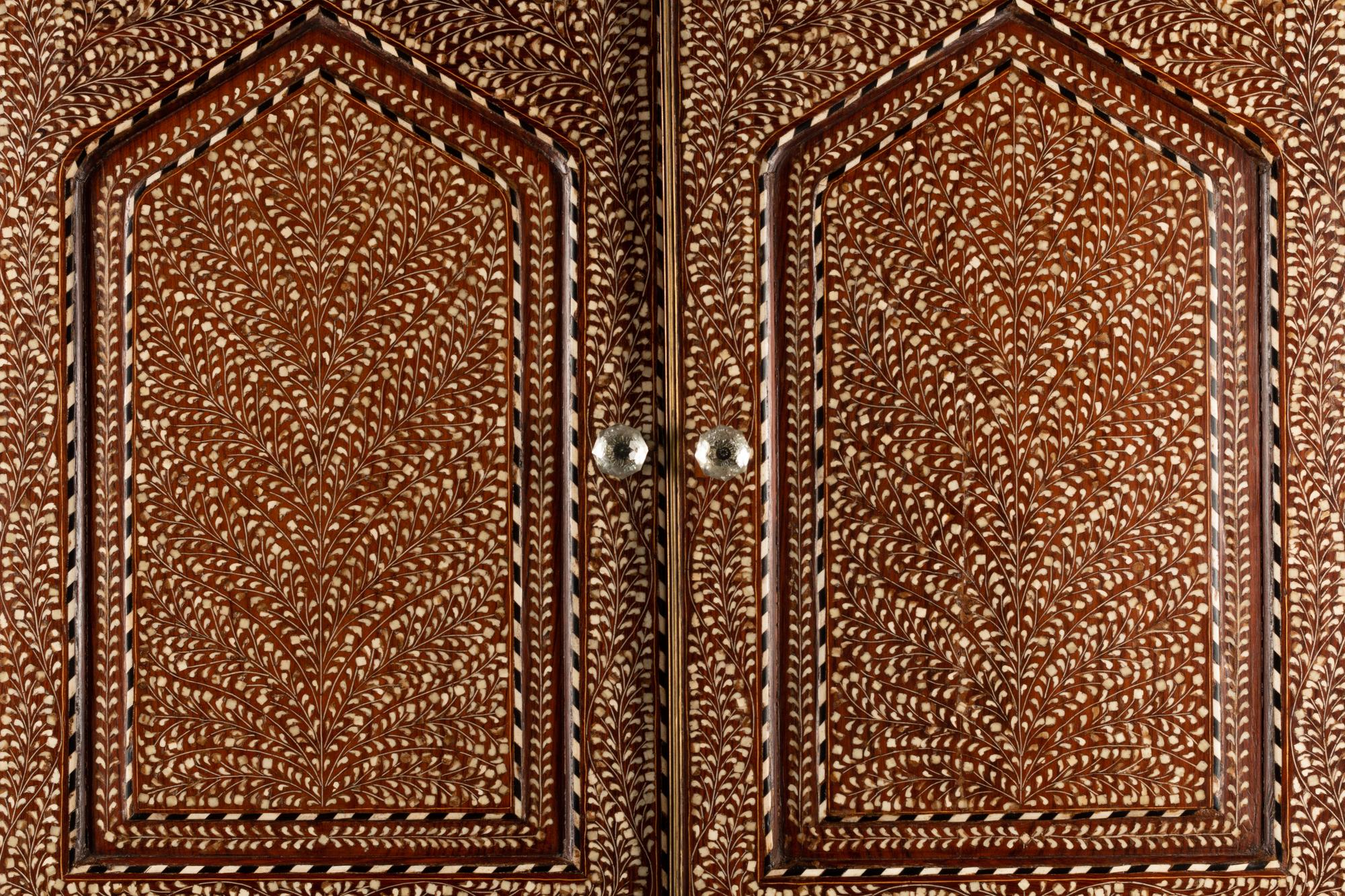 An Anglo-Colonial Bone Inlaid Two-Part Cabinet