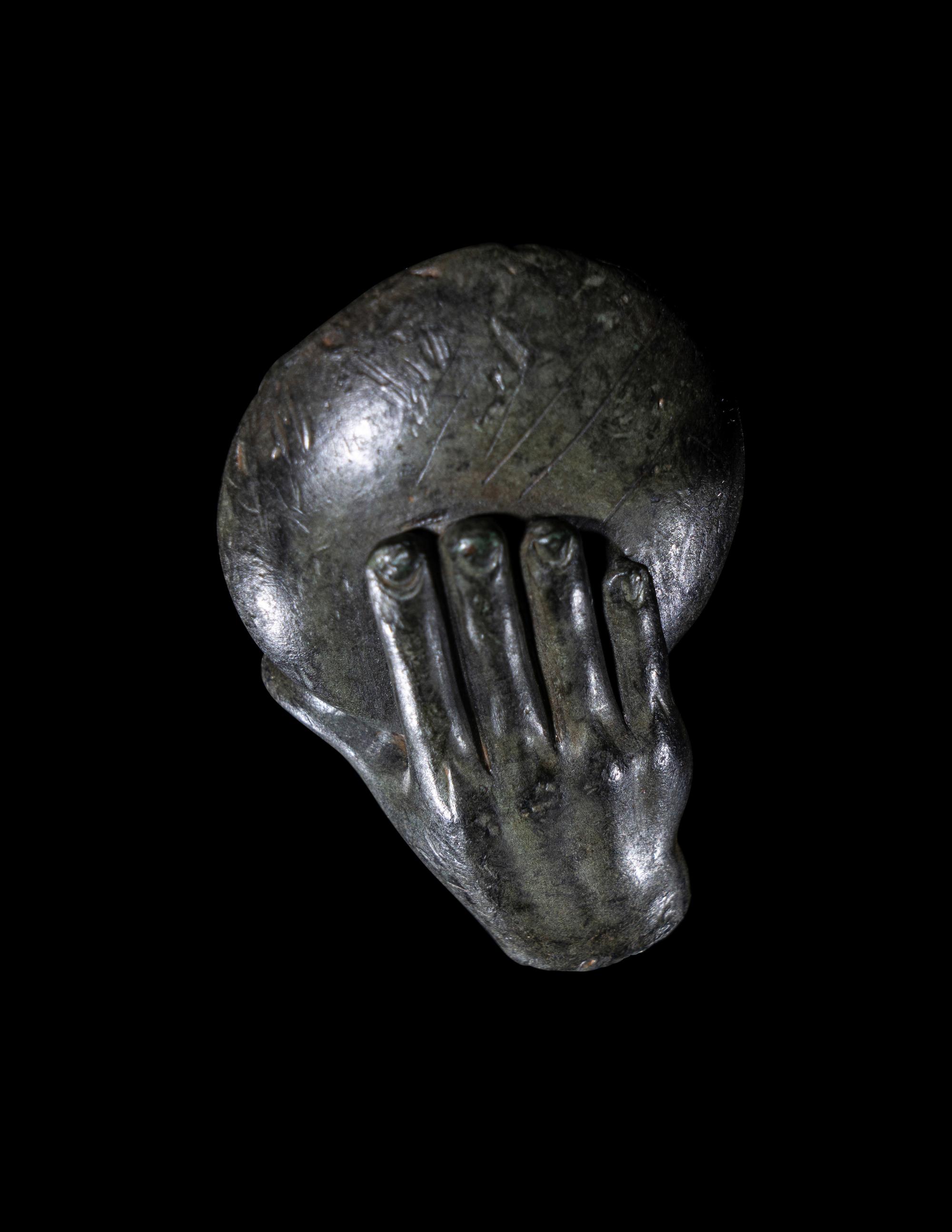 A Greek Bronze Hand of a Satyr Holding a Phiale