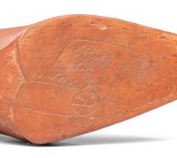 A Glazed Pottery Woman's High-Heeled Shoe