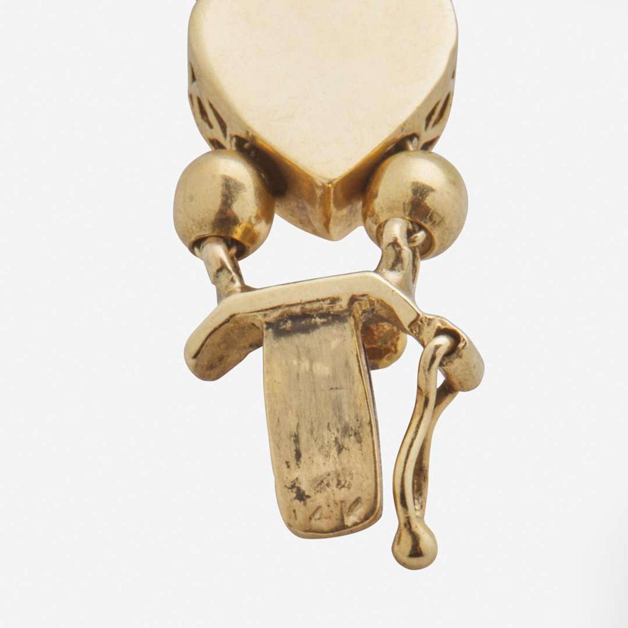 A 14K Yellow Gold Vintage Slide Charm Bracelet