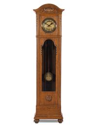 A Continental Oak Tall Case Clock