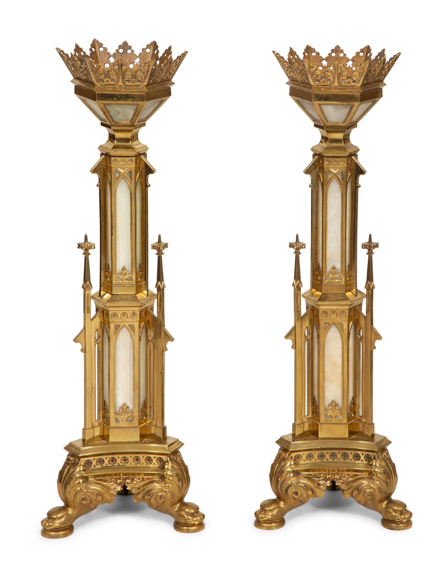 A Pair of Gothic Style Brass and Inset Glass Candlesticks