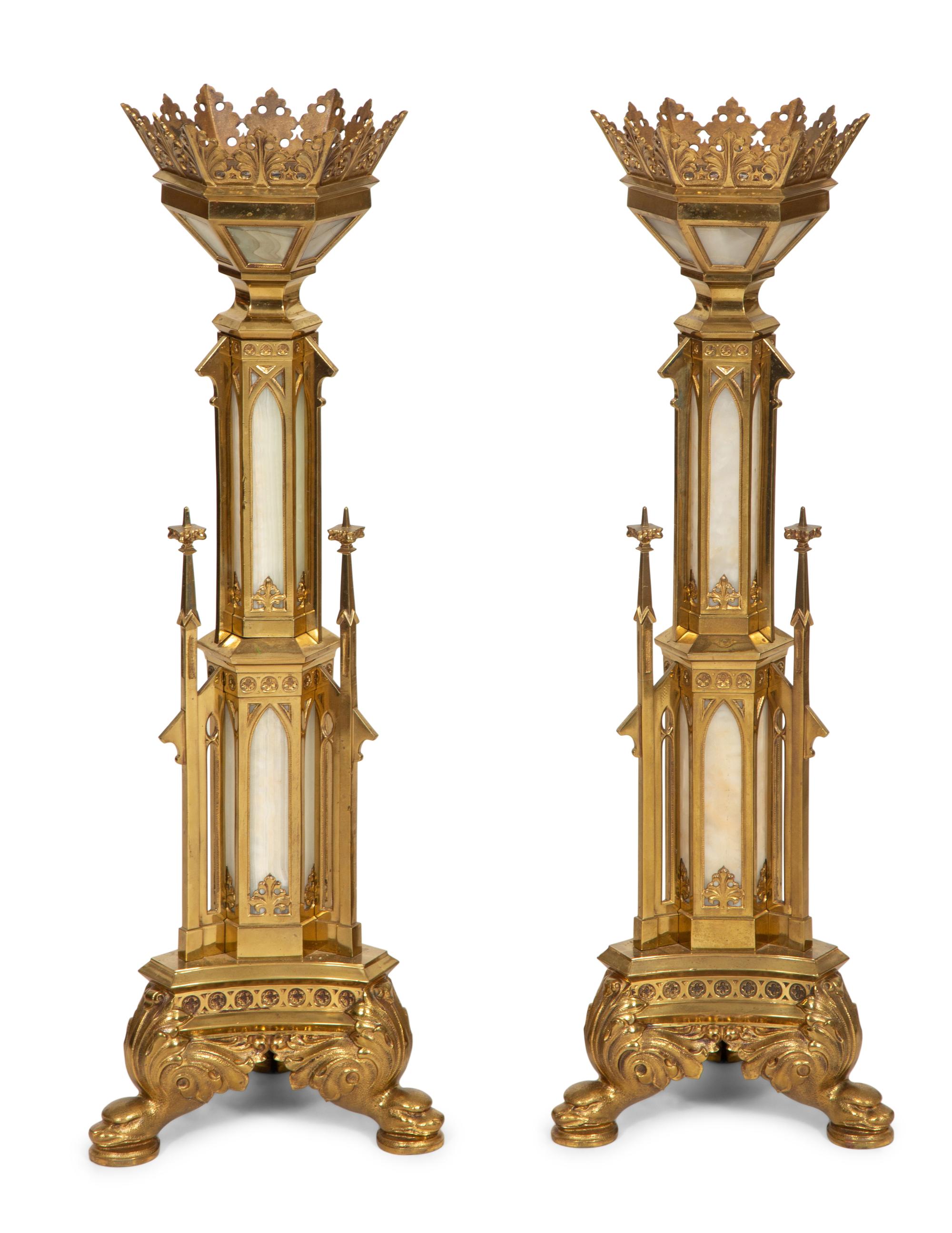 A Pair of Gothic Style Brass and Inset Glass Candlesticks