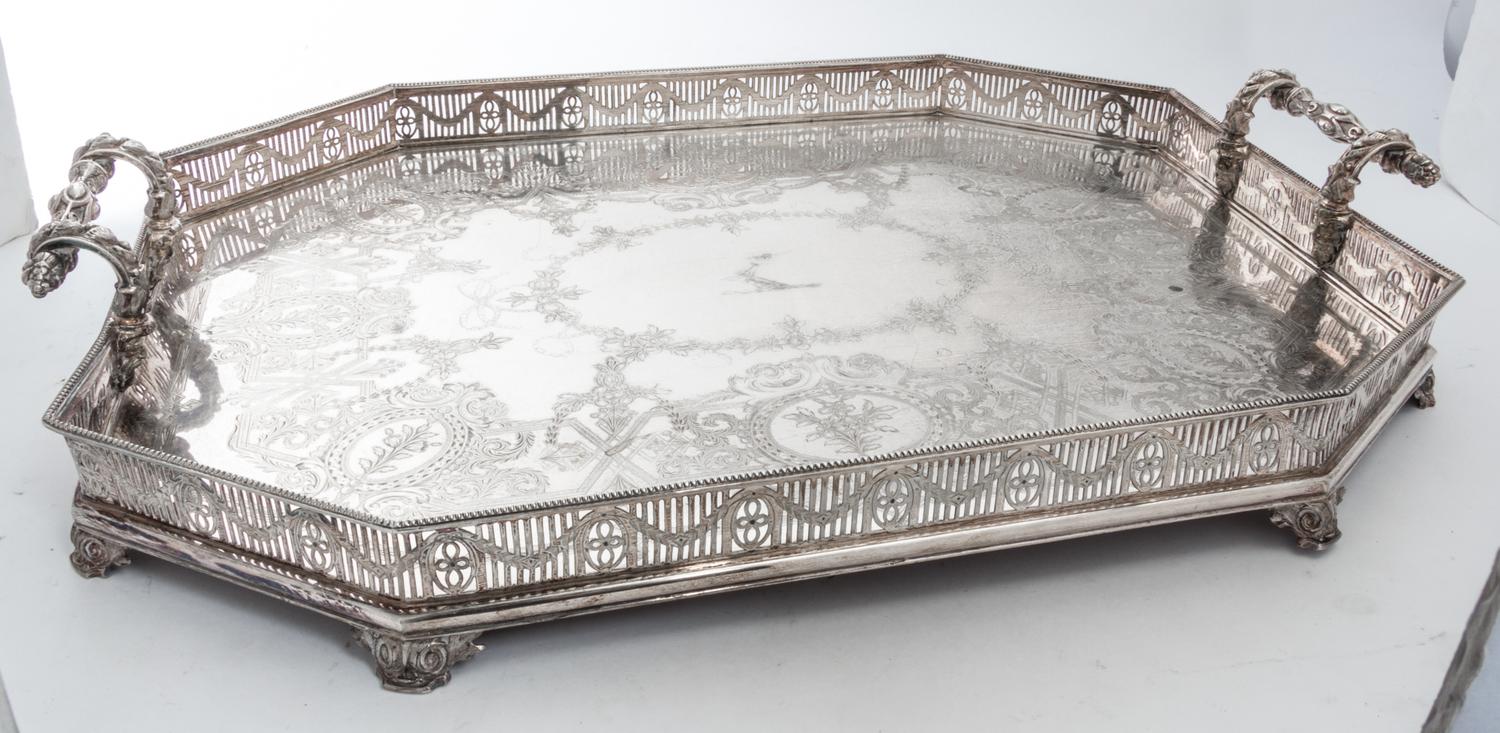 A Group of Silver-Plate Serving Trays Width of widest over handles 30 inches.