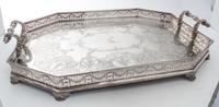 A Group of Silver-Plate Serving Trays Width of widest over handles 30 inches.