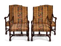 Four Spanish Colonial Style Carved Mahogany Open Armchairs — 20TH CENTURY
