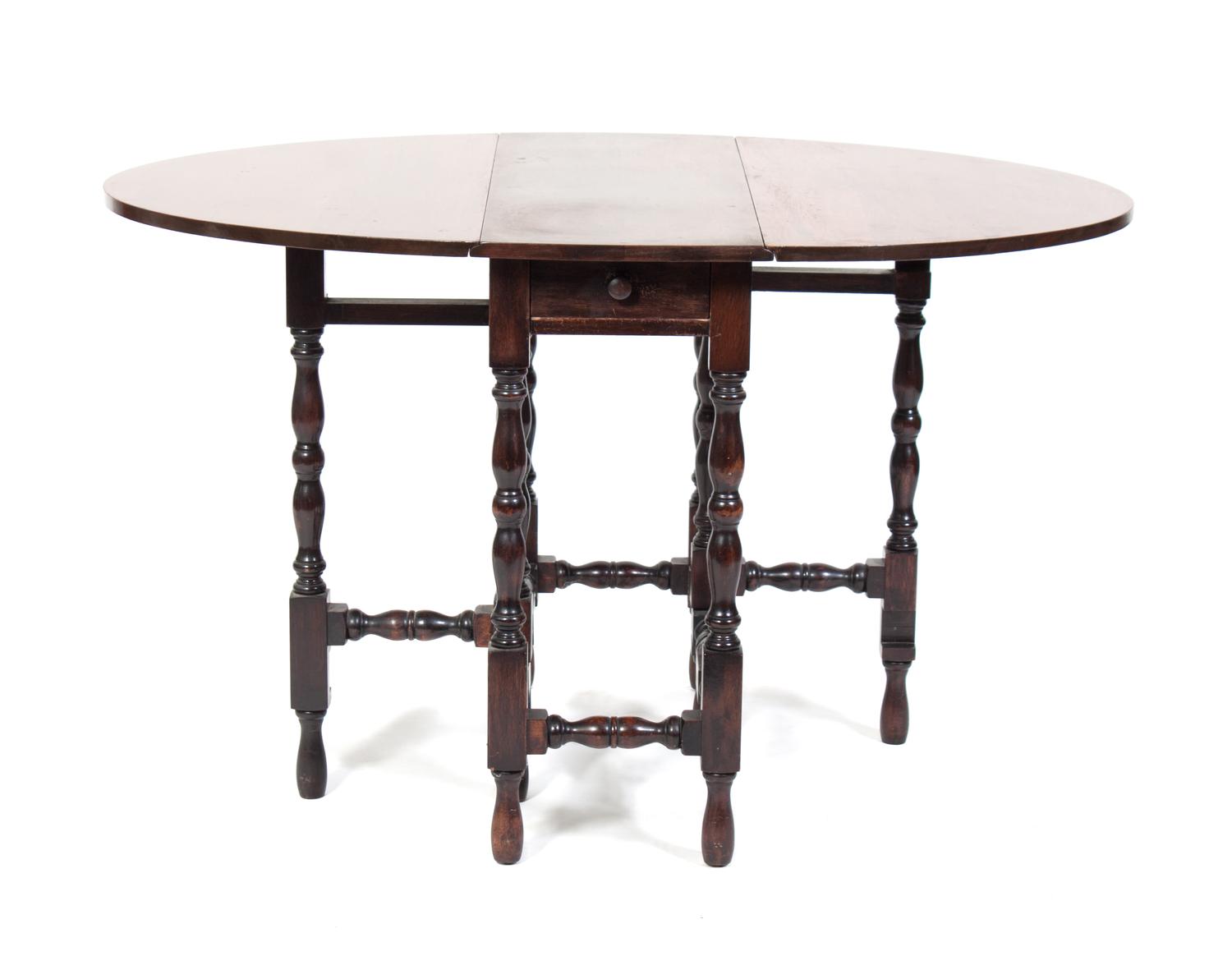 A Gate-Leg Table Height 29 x width 48 x depth 24 inches.