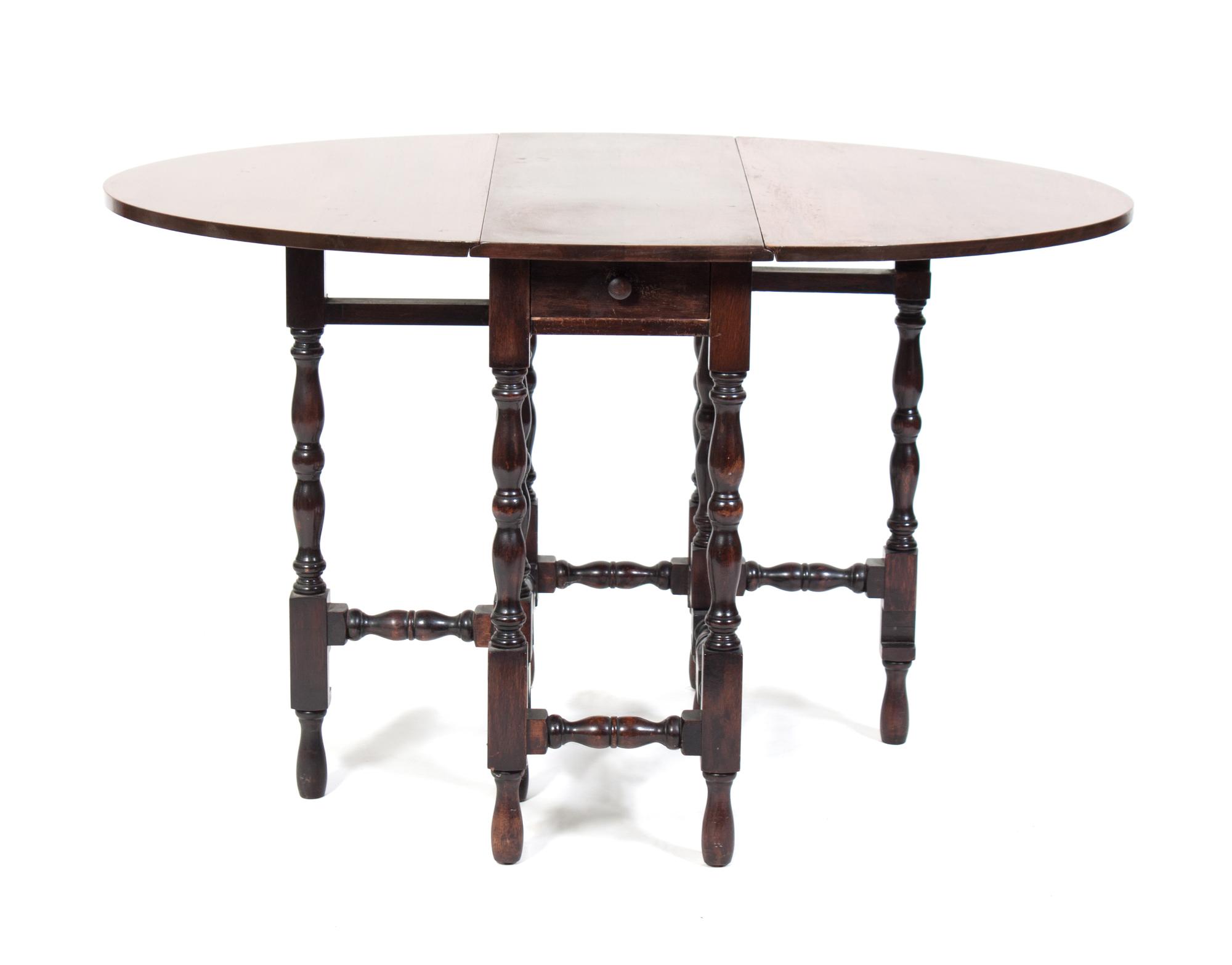 A Gate-Leg Table Height 29 x width 48 x depth 24 inches.