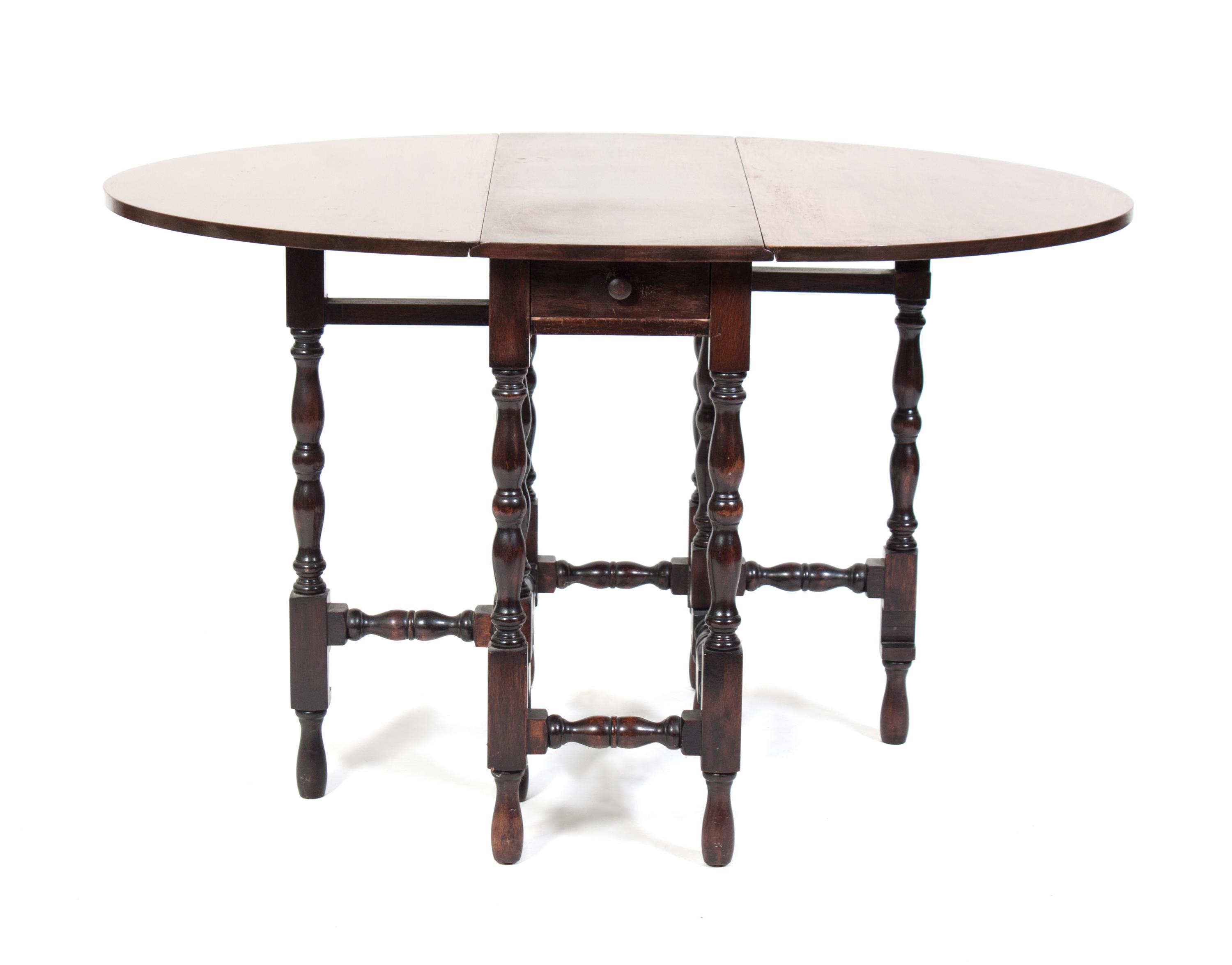 A Gate-Leg Table Height 29 x width 48 x depth 24 inches.