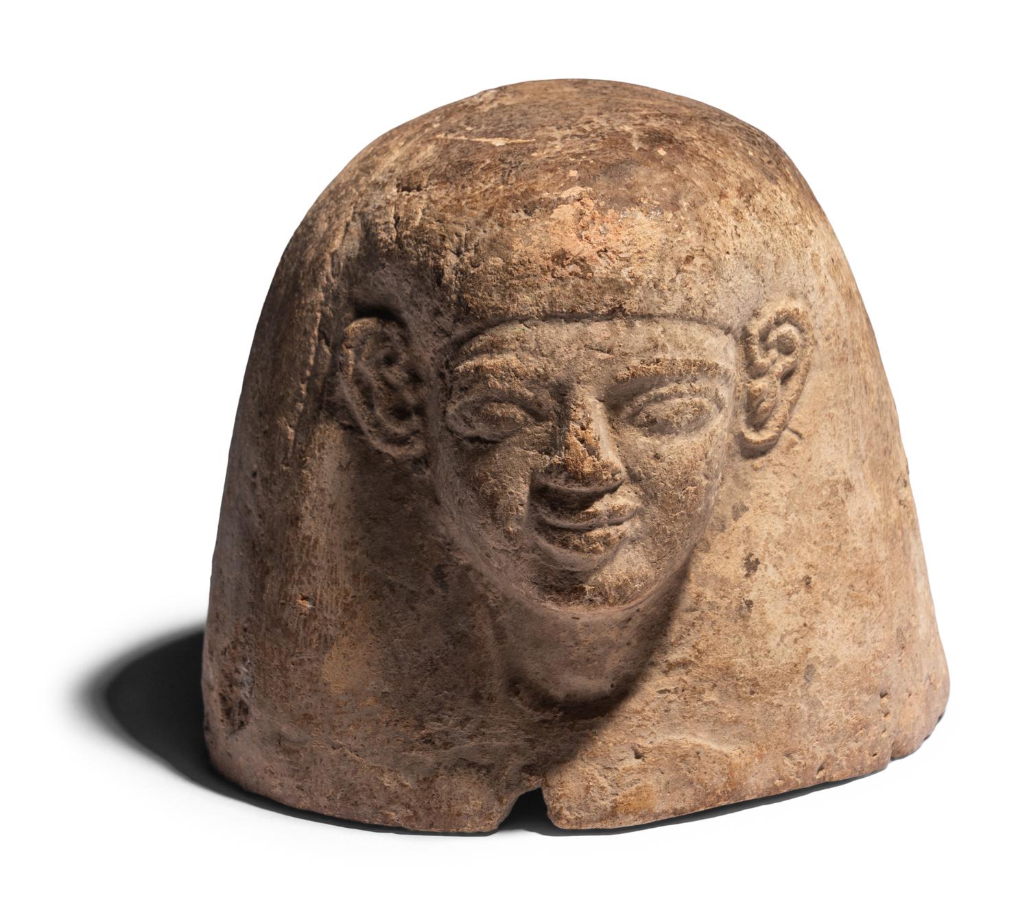An Egyptian Plaster Canopic Jar Lid of Amset