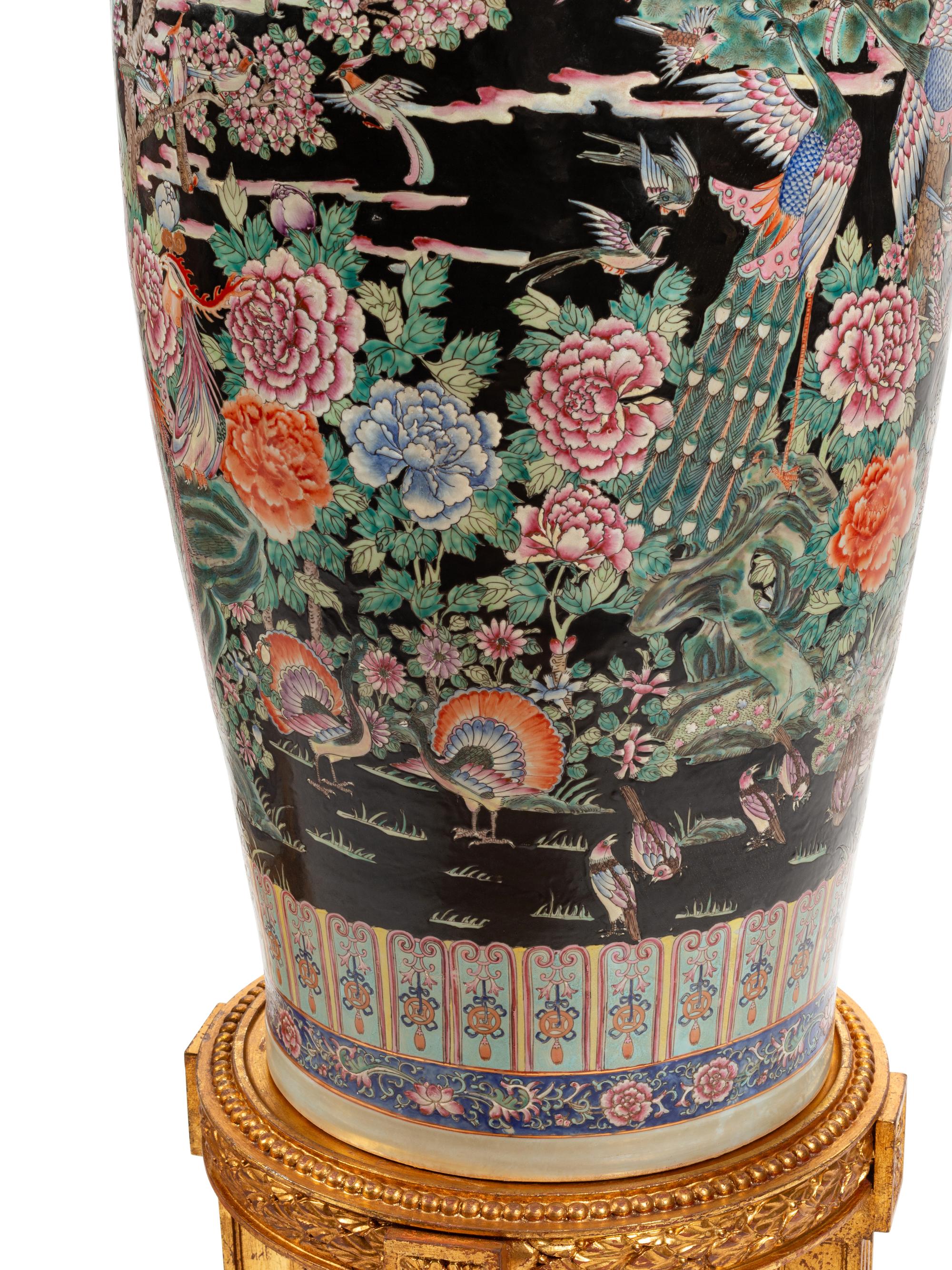A Pair of Massive Chinese Enameled Porcelain Vases with Giltwood Stands