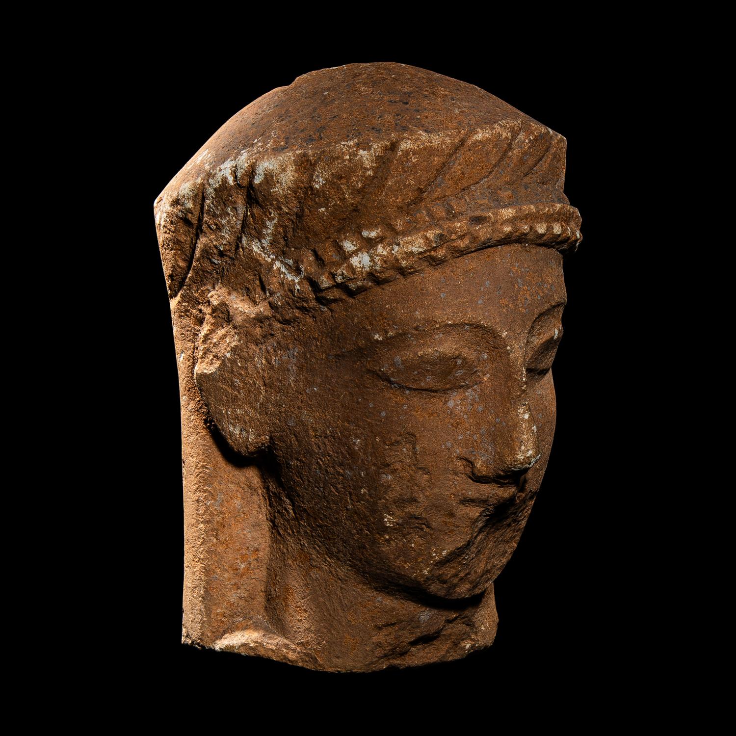 A Cypriot Limestone Votive Head