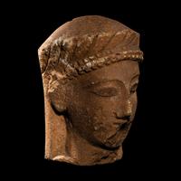 A Cypriot Limestone Votive Head