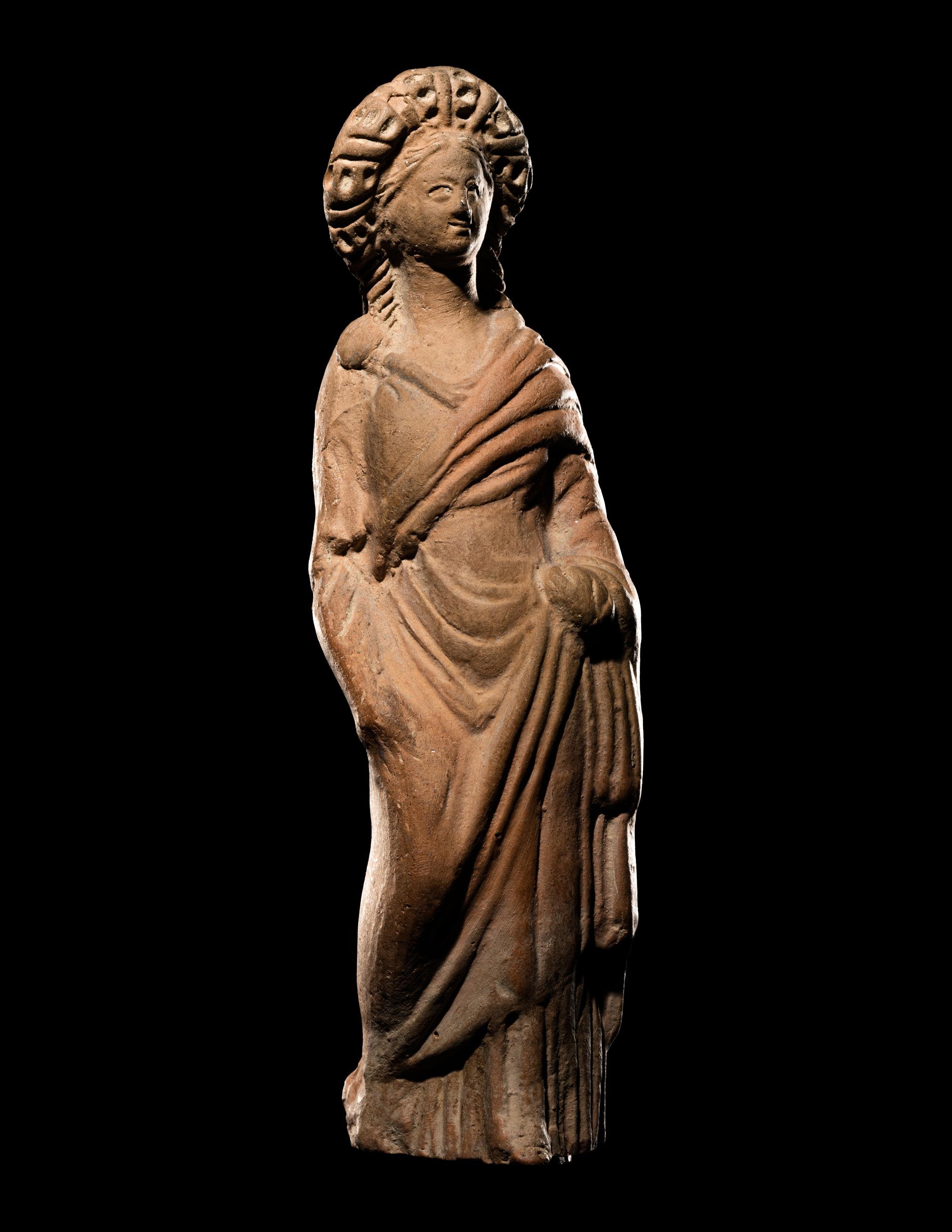 A Greek Terracotta Standing Draped Female