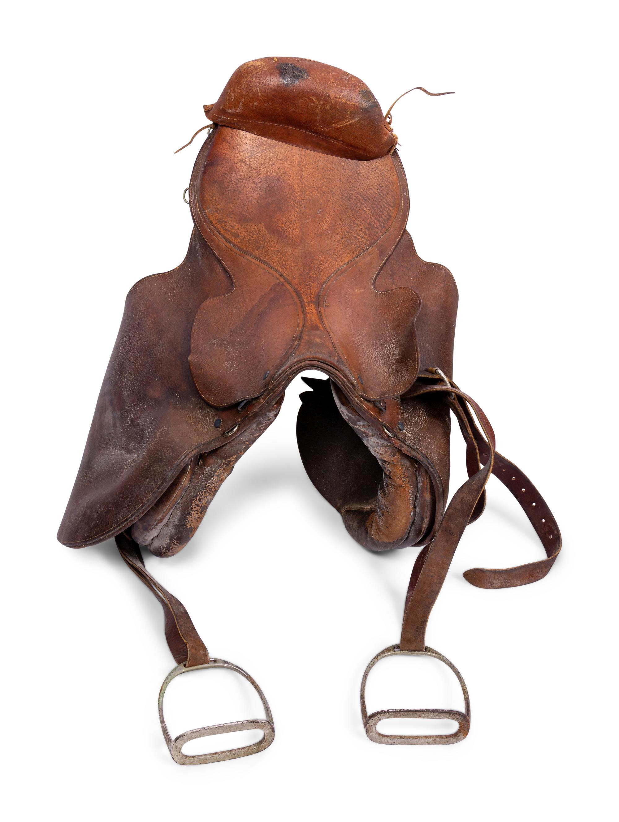A Group of Three Leather Saddles, Including One by Abercrombie and Fitch