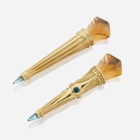 A pair of gold, citrine, aquamarine, and blue topaz brooches