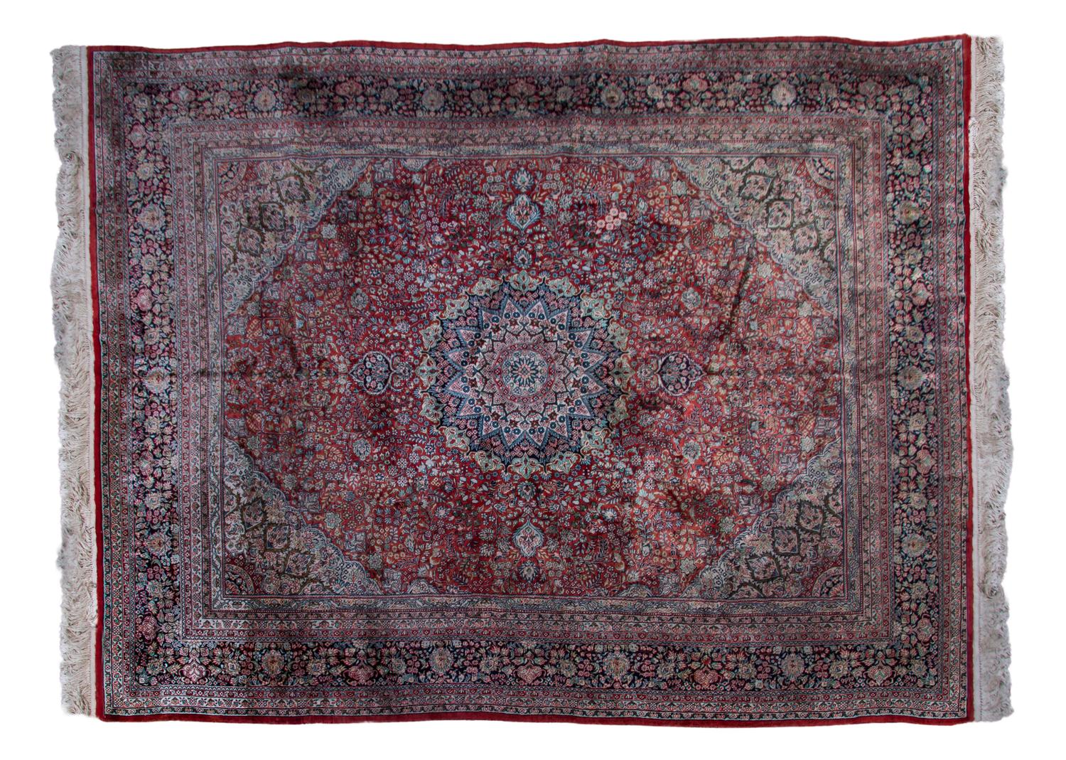 A Persian Silk and Wool Rug, 9 feet 11 inches x 8 feet.