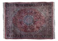 A Persian Silk and Wool Rug, 9 feet 11 inches x 8 feet.