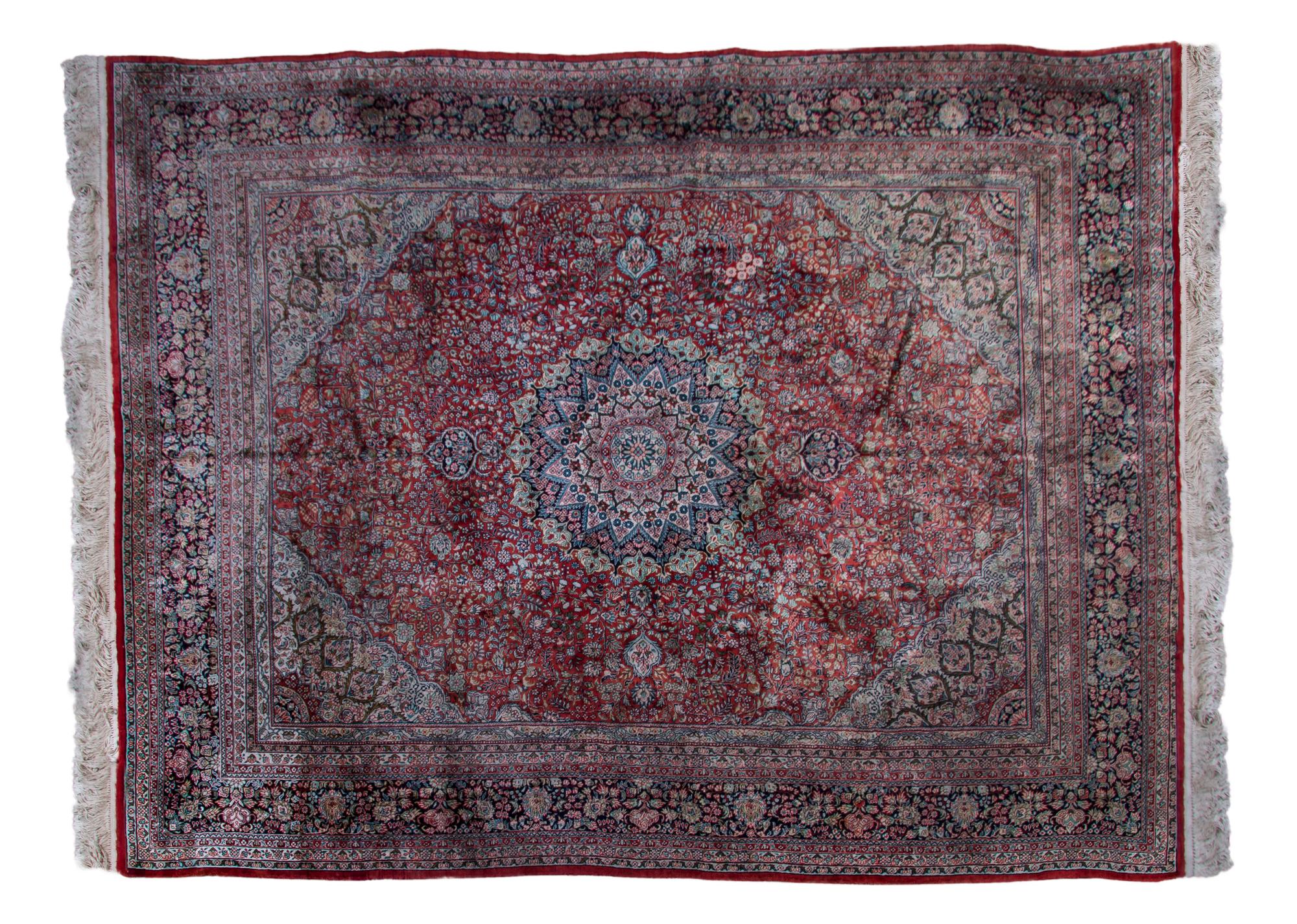 A Persian Silk and Wool Rug, 9 feet 11 inches x 8 feet.