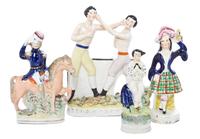An Associated Group of Four Staffordshire Figures, Height of tallest 9 1/2 inches.