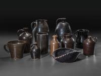 Eleven Albany Slip Stoneware and Redware Vessels
