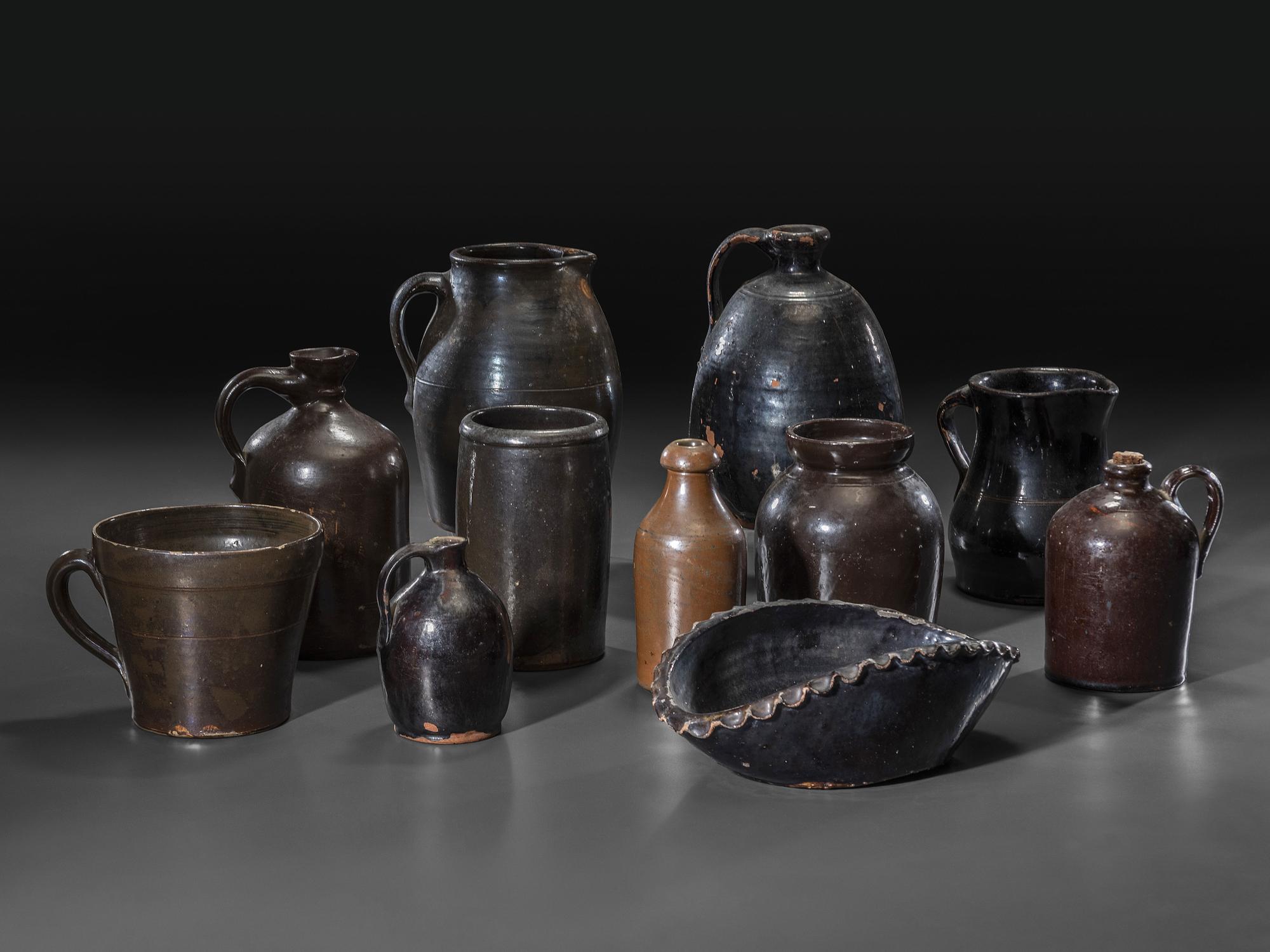 Eleven Albany Slip Stoneware and Redware Vessels
